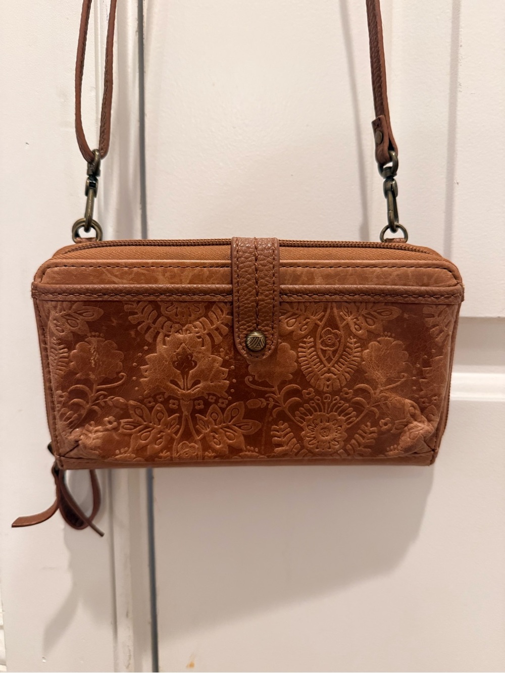 The Sak Embossed Floral Leather Crossbody in Cognac